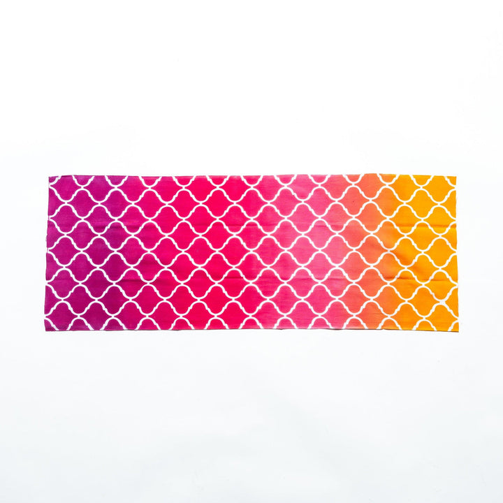 Moroccan tile-patterned pink tenugui hand towel laid flat, showcasing its full design.