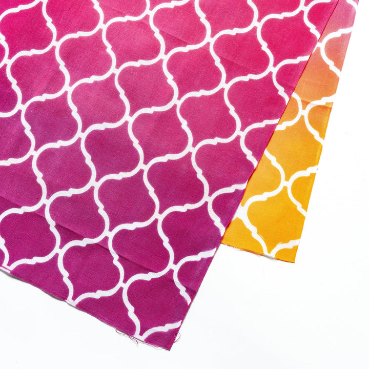 Close-up view of the white lattice pattern on the vibrant pink tenugui hand towel.