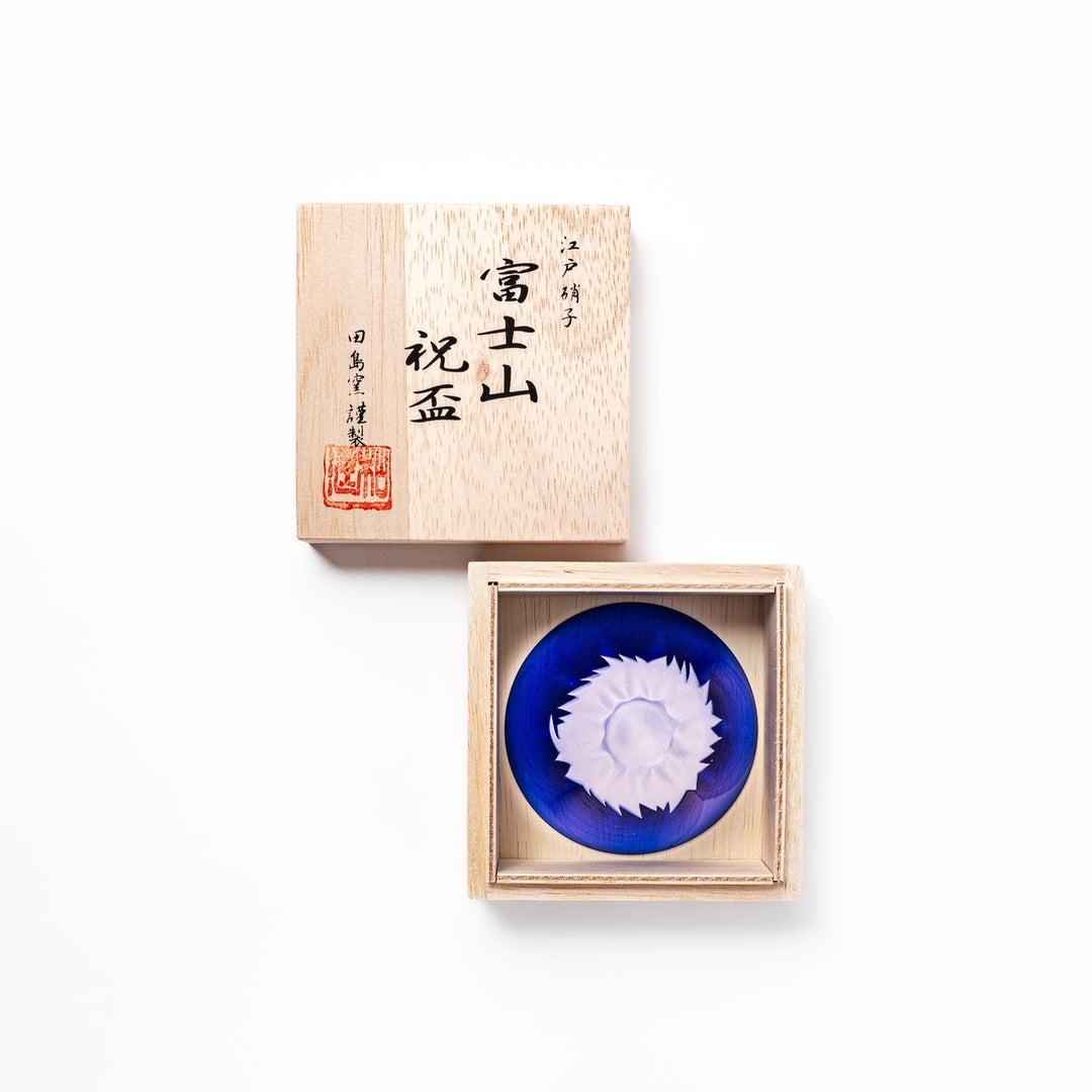Blue glass sake cup shaped like Mount Fuji with a frosted white snowcap, ideal for celebrations and authentic Japanese dining.
