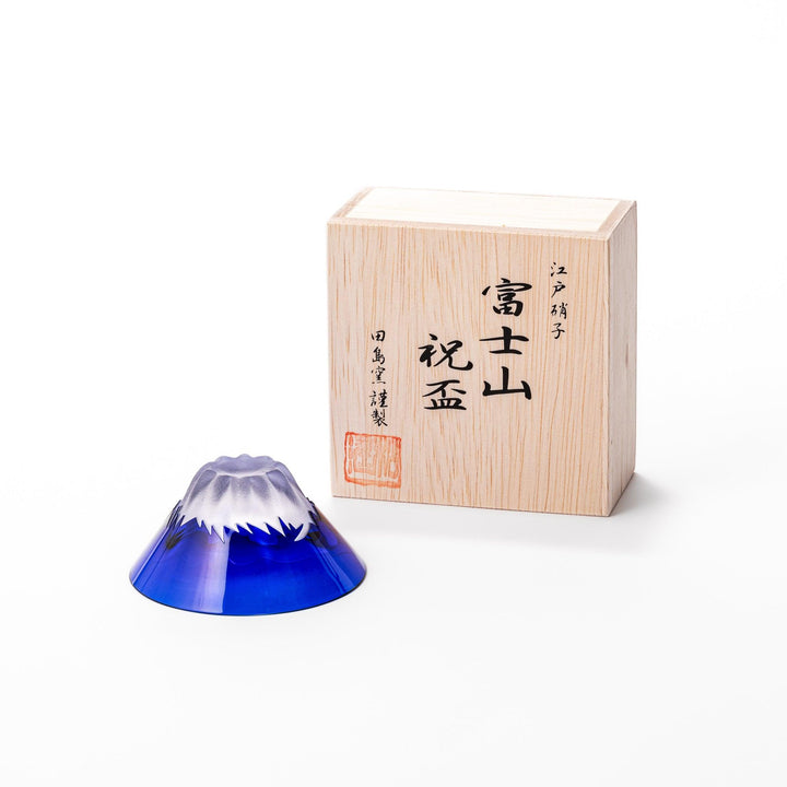 Blue glass sake cup shaped like Mount Fuji with a frosted white snowcap, ideal for celebrations and authentic Japanese dining.