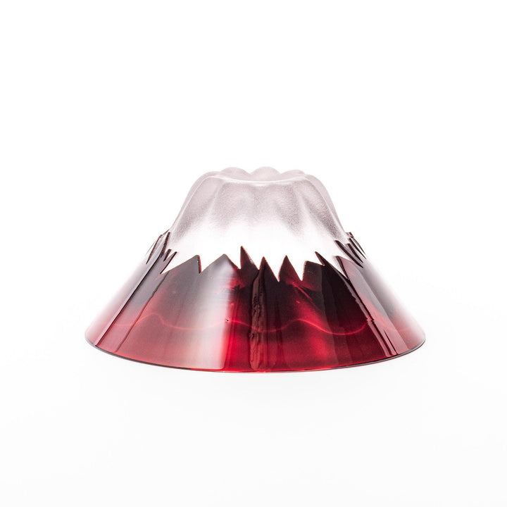 Red glass sake cup in the form of Mount Fuji, complete with a frosted snowcap design, crafted for elegant Japanese-style celebrations.