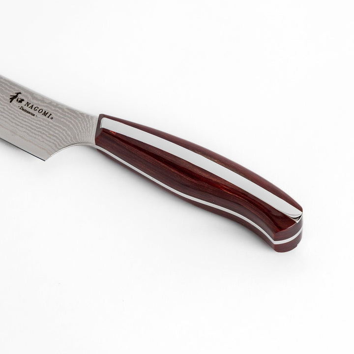 A high-quality Nagomi Damascus utility knife with a beautifully patterned blade and a striped wooden handle, offering excellent precision for everyday kitchen tasks.
