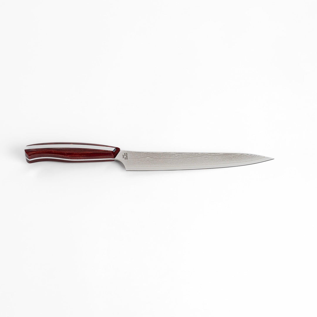 A high-quality Nagomi Damascus utility knife with a beautifully patterned blade and a striped wooden handle, offering excellent precision for everyday kitchen tasks.