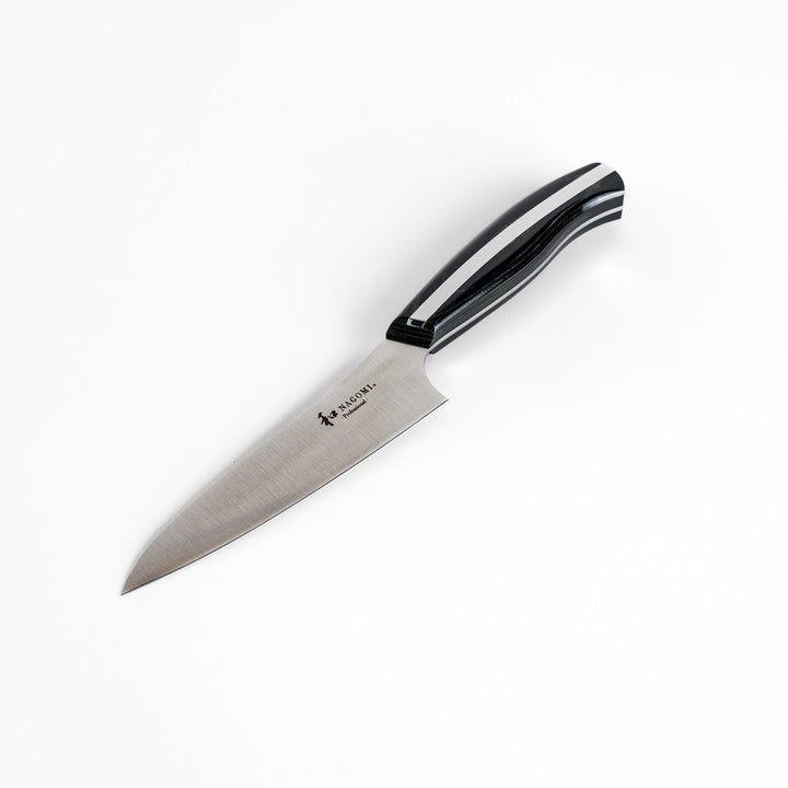A Nagomi Professional utility knife with a sleek, sharp blade and a modern striped handle, offering precision and comfort for all your kitchen tasks.
