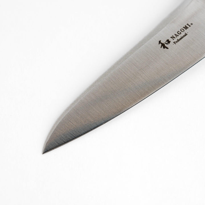 A Nagomi Professional utility knife with a sleek, sharp blade and a modern striped handle, offering precision and comfort for all your kitchen tasks.