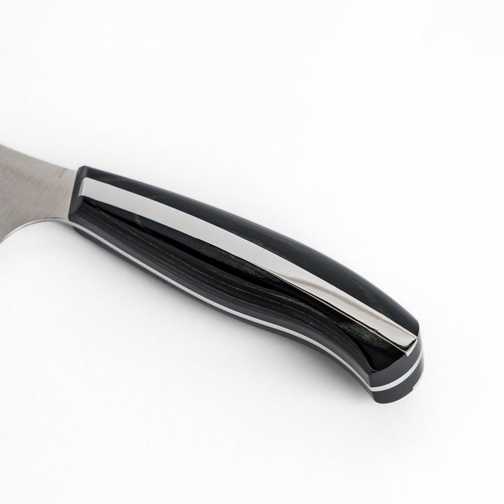 A Nagomi Professional utility knife with a sleek, sharp blade and a modern striped handle, offering precision and comfort for all your kitchen tasks.
