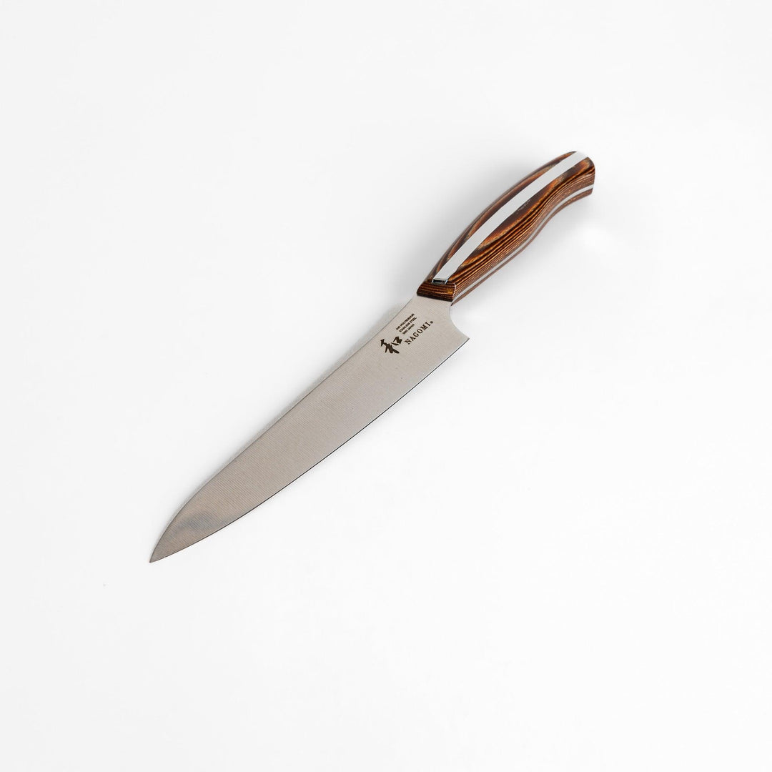 A Nagomi utility knife featuring a sharp, durable blade and a beautifully crafted striped wooden handle, designed for precision and comfort in various kitchen tasks.