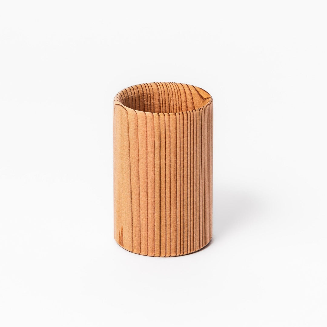 Natural cedar sake cup with a smooth curved rim and vertical grain lines, offering a warm, aromatic touch to your traditional Japanese drinkware.