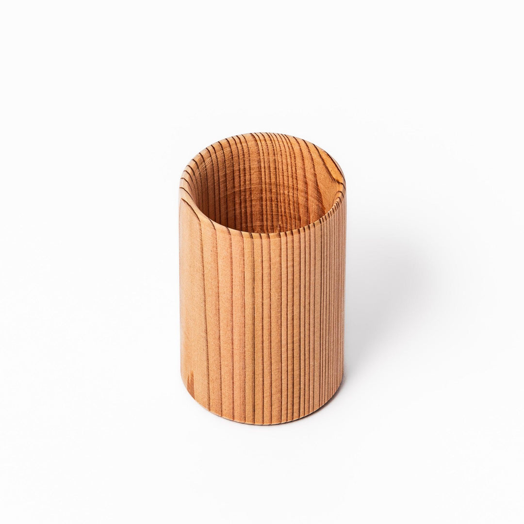 Natural cedar sake cup with a smooth curved rim and vertical grain lines, offering a warm, aromatic touch to your traditional Japanese drinkware.