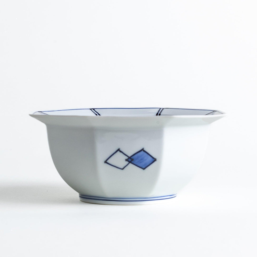 An octagonal porcelain cereal bowl with a minimalist grid pattern