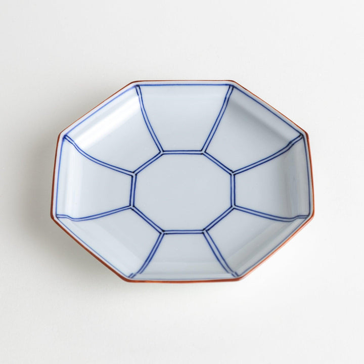 An octagonal porcelain large dessert plate with a minimalist grid pattern.