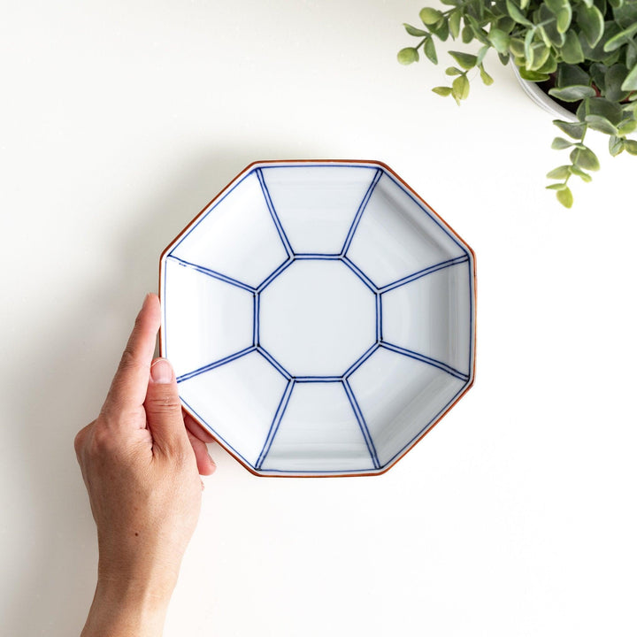 An octagonal porcelain large dessert plate with a minimalist grid pattern.