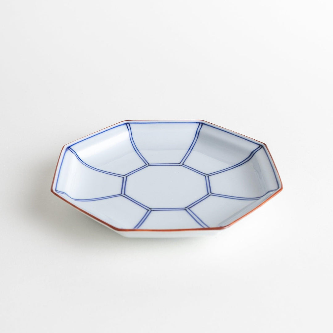 An octagonal porcelain large dessert plate with a minimalist grid pattern.