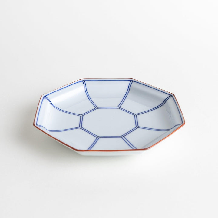 An octagonal porcelain large dessert plate with a minimalist grid pattern.