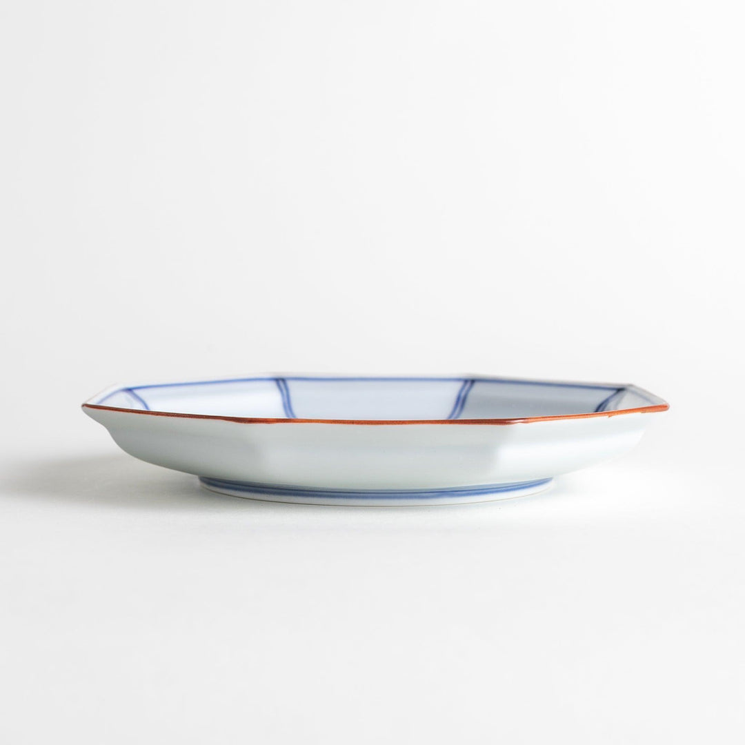 An octagonal porcelain large dessert plate with a minimalist grid pattern.