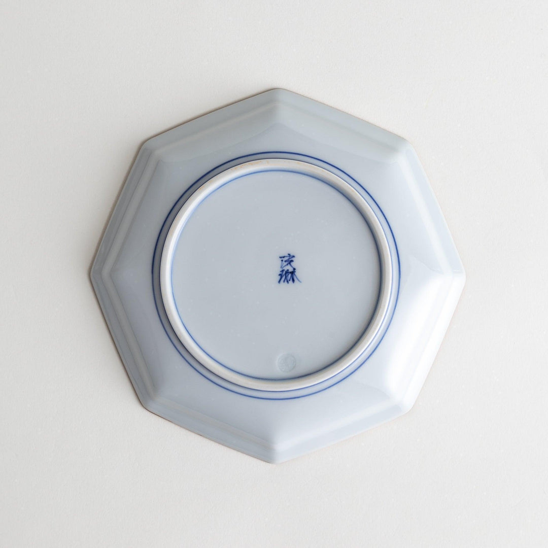 An octagonal porcelain large dessert plate with a minimalist grid pattern.