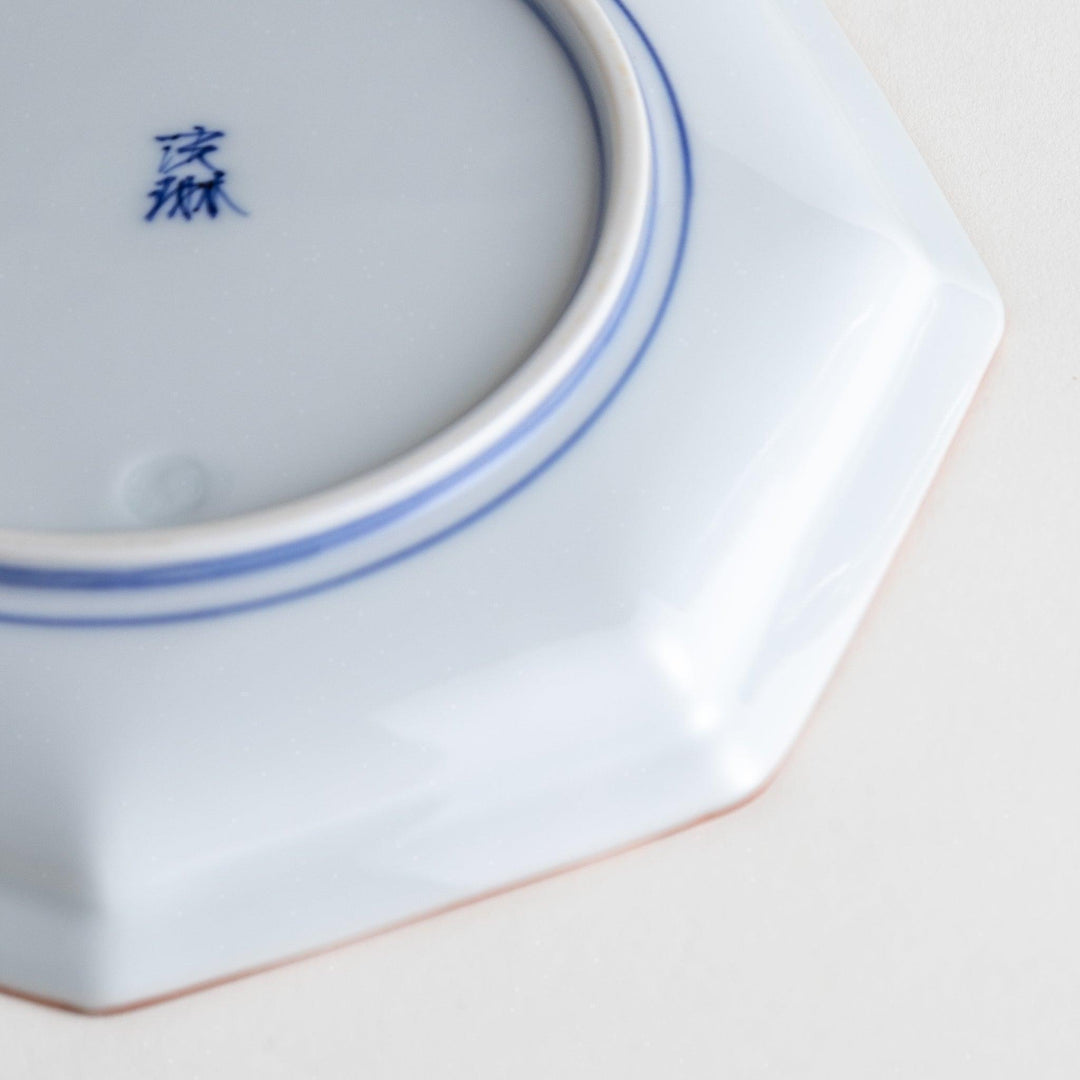 An octagonal porcelain large dessert plate with a minimalist grid pattern.