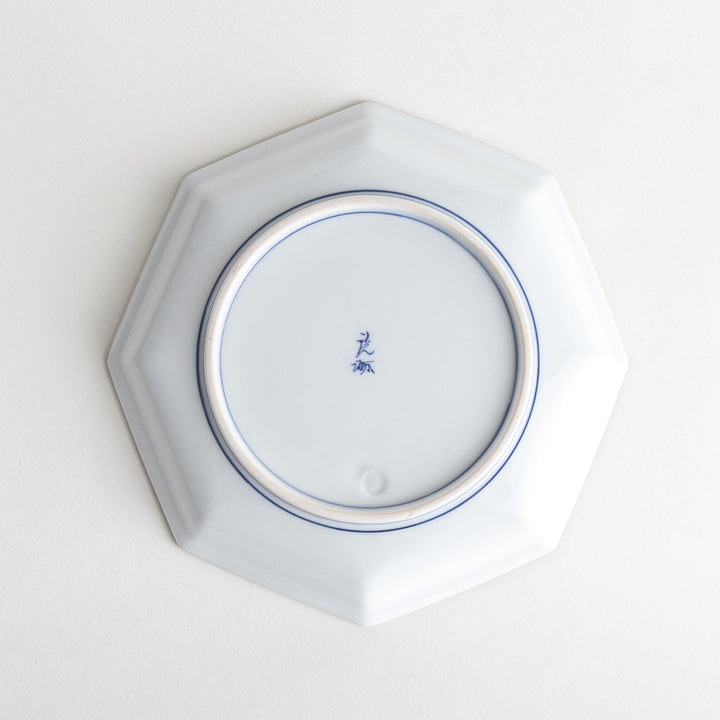 An octagonal porcelain salad plate with a minimalist grid pattern.