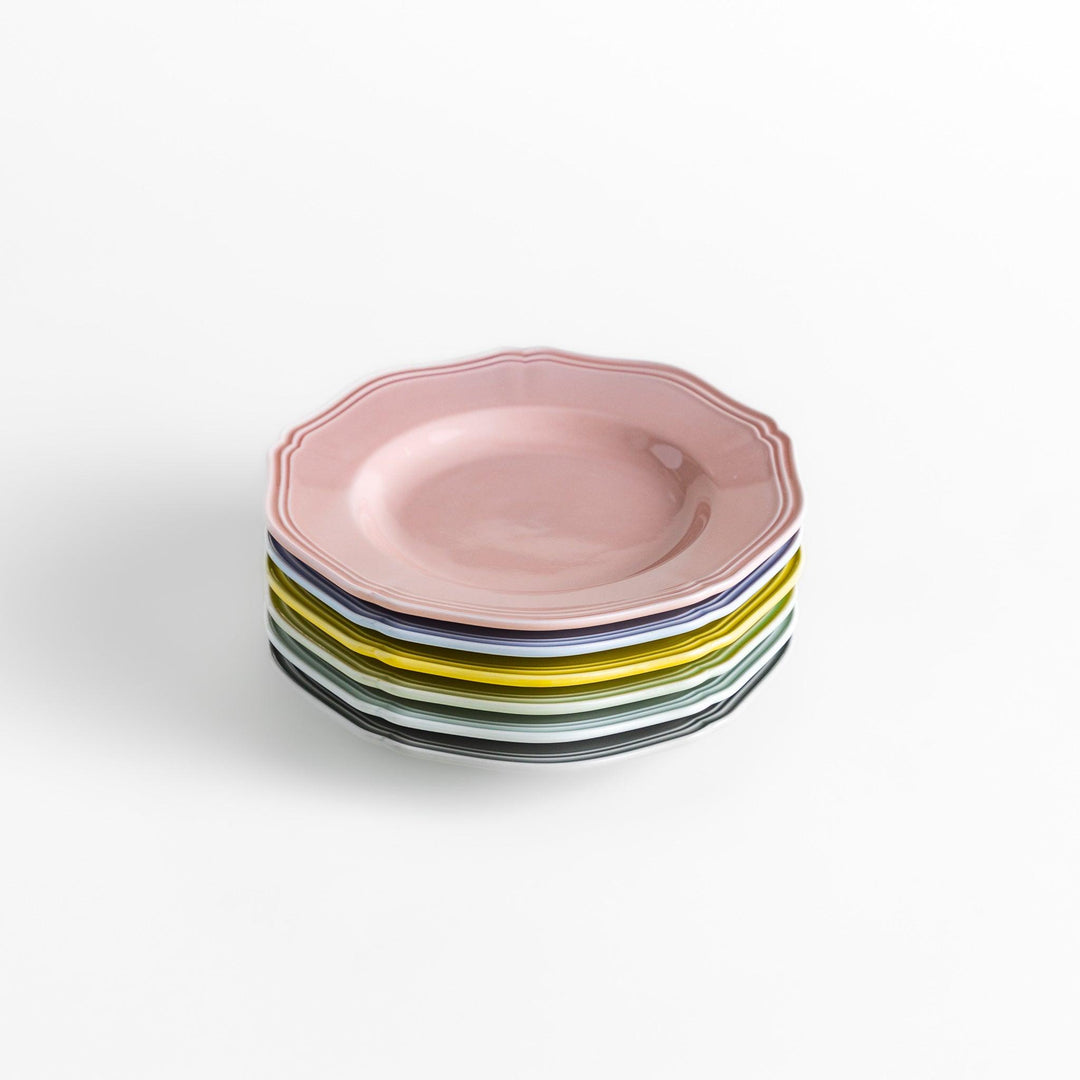 A stack of six pastel-colored dessert plates in pink, blue, yellow, green, white, and gray, each featuring an elegant scalloped edge, perfect for adding a delicate touch to your table.