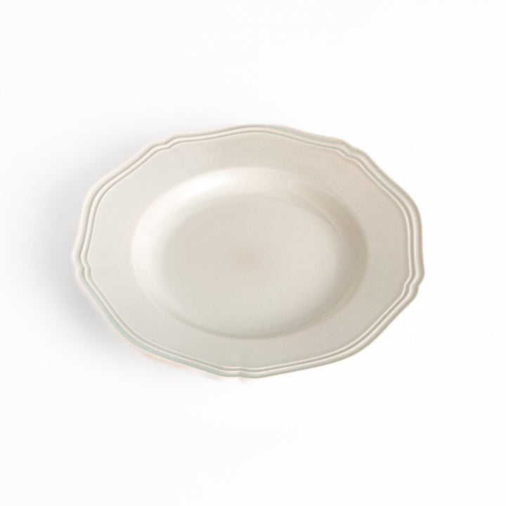 Pretty white dessert plate with a delicate scalloped edge, ideal for showcasing your favorite treats.