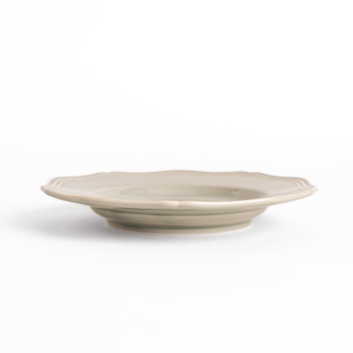 Pretty gray dessert plate with a delicate scalloped edge, ideal for showcasing your favorite treats.