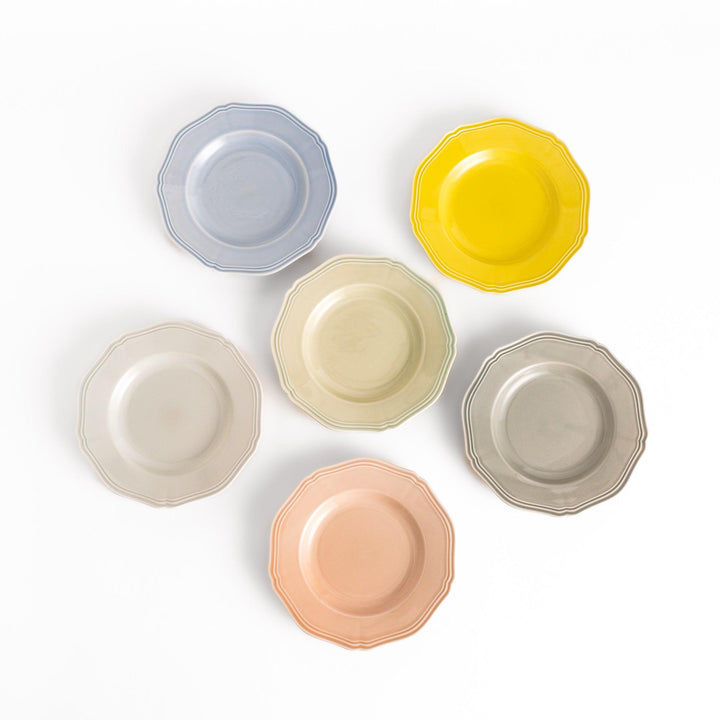 Six pastel-colored dessert plates in pink, blue, yellow, green, white, and gray, each featuring an elegant scalloped edge, perfect for adding a delicate touch to your table.