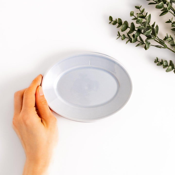 Durable and elegant blue ceramic dessert plate, adding a pop of sunshine to your table setting.