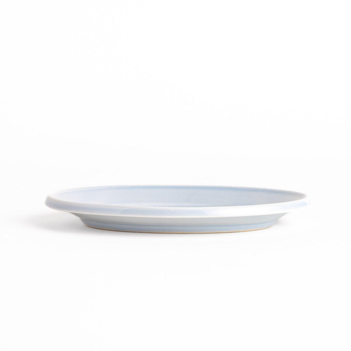 Durable and elegant blue ceramic dessert plate, adding a pop of sunshine to your table setting.