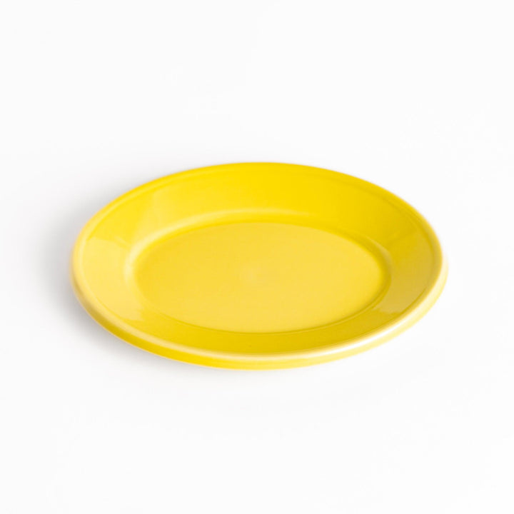 Durable and elegant yellow ceramic dessert plate, adding a pop of sunshine to your table setting.