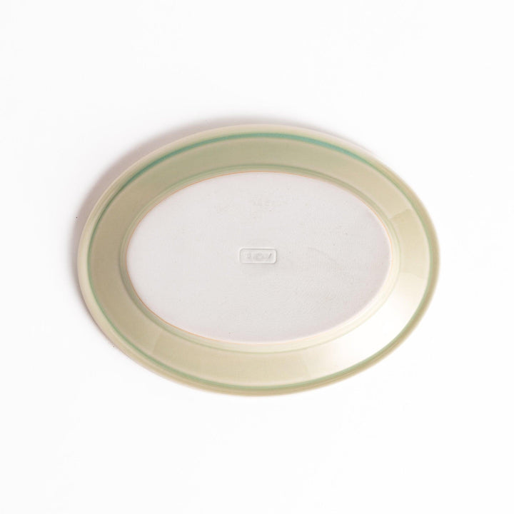 Durable and elegant green ceramic dessert plate, adding a pop of sunshine to your table setting.