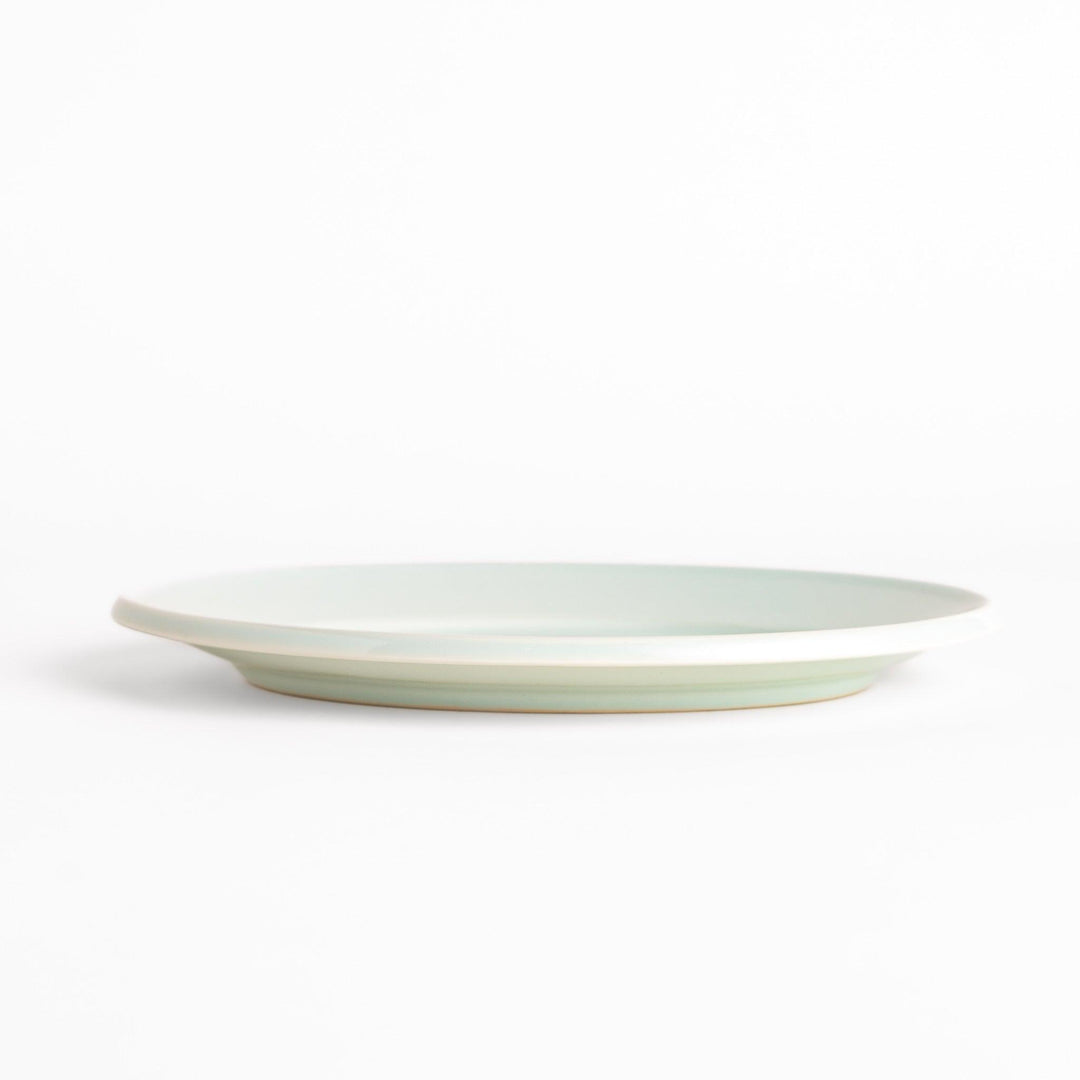 Durable and elegant white ceramic salad plate, adding a pop of color to your table setting.