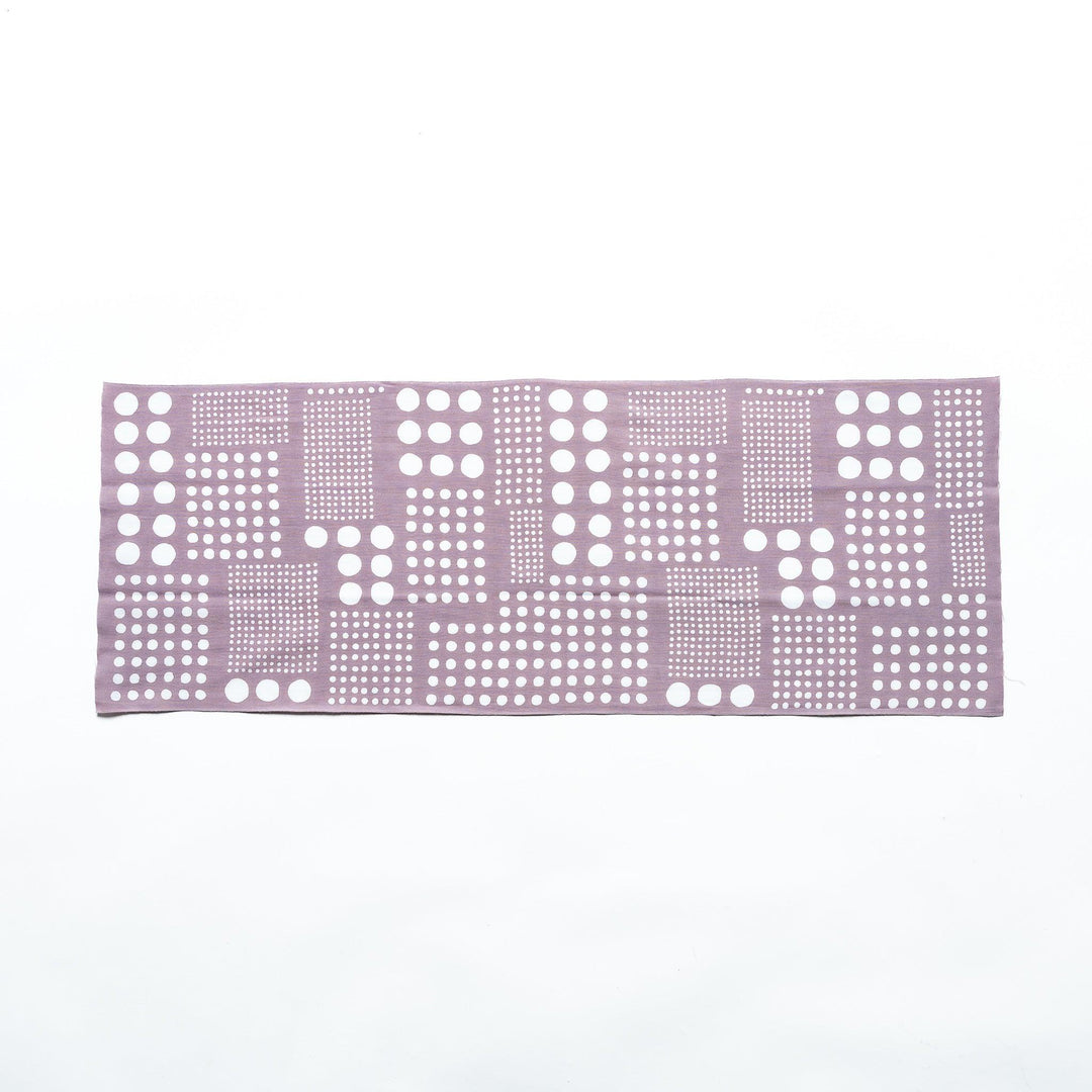 Purple gray polka dot tenugui hand towel laid flat, showing white dots arranged in square patterns.