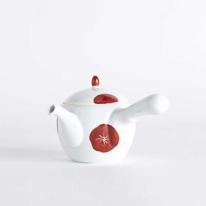 Teapot with a white body and red plum blossom designs, featuring a matching lid and handle, showcasing a traditional yet elegant style.