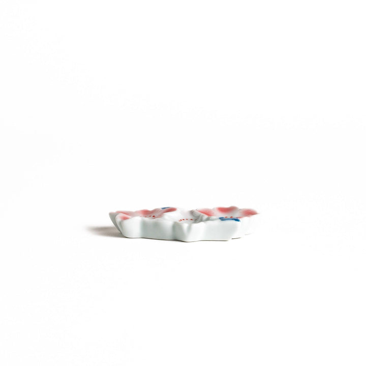 Sakura Blossom Chopstick Rest featuring delicate pink sakura flowers with blue accents, adding a touch of elegance to your table setting.