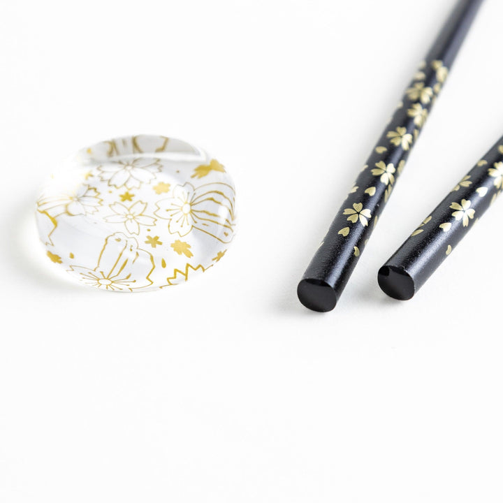 Red lacquer chopsticks with sakura patterns. Available in black or red.