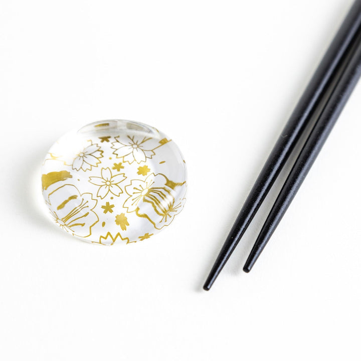 Red lacquer chopsticks with sakura patterns. Available in black or red.