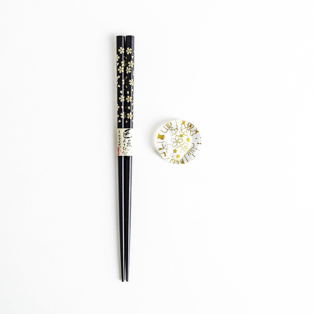 Red lacquer chopsticks with sakura patterns. Available in black or red.