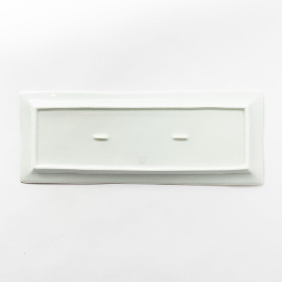 Back view of a rectangular plate, entirely white, showcasing its clean and simple base design.