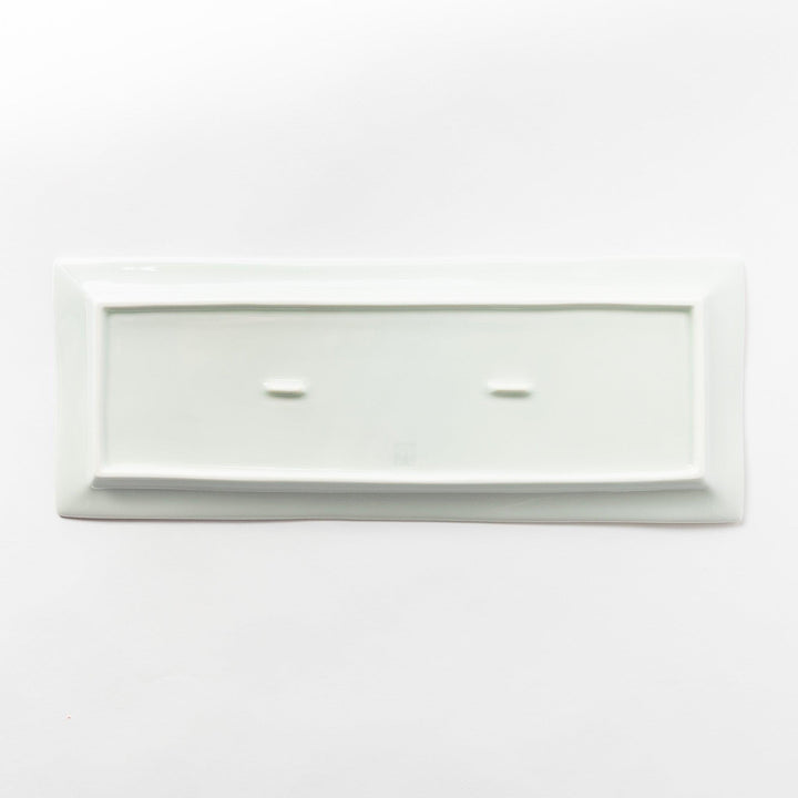 Back view of a rectangular plate, entirely white, showcasing its clean and simple base design.