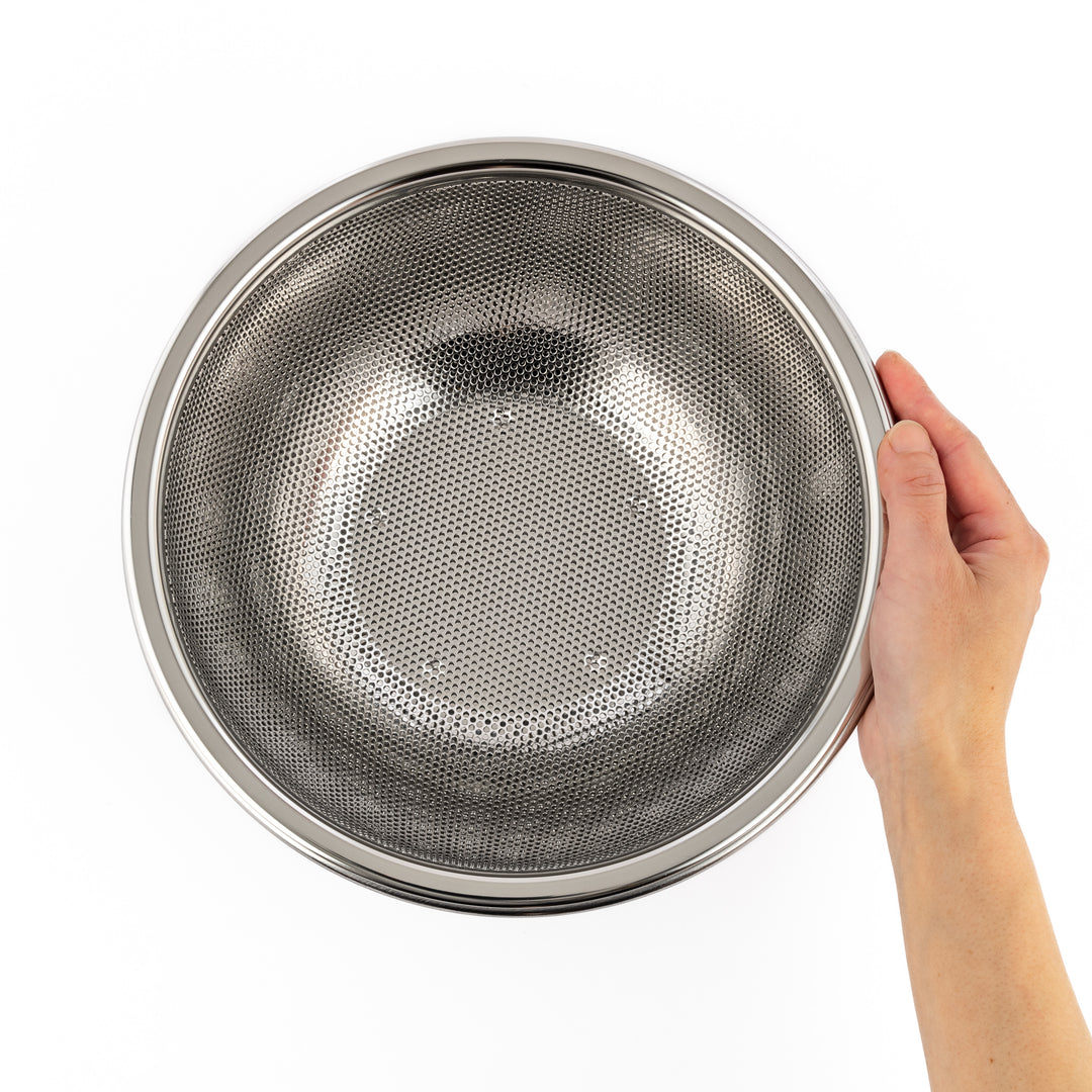 Stainless steel mesh strainer bowl with fine perforations and a sturdy rim, ideal for rinsing rice, vegetables, or draining pasta with ease.