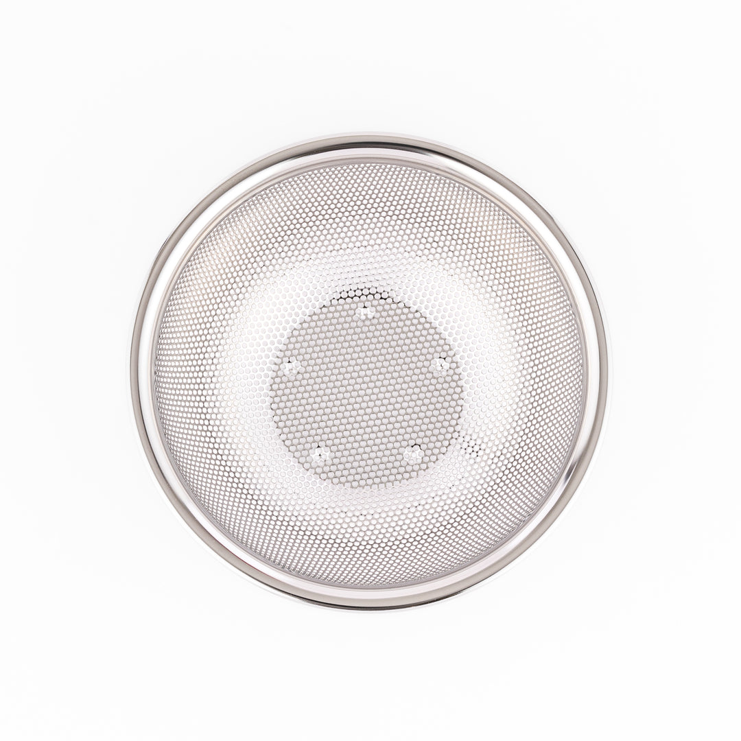 Fine mesh stainless steel strainer bowl with wide rim and curved shape, ideal for washing grains, fruits, or vegetables with ease.