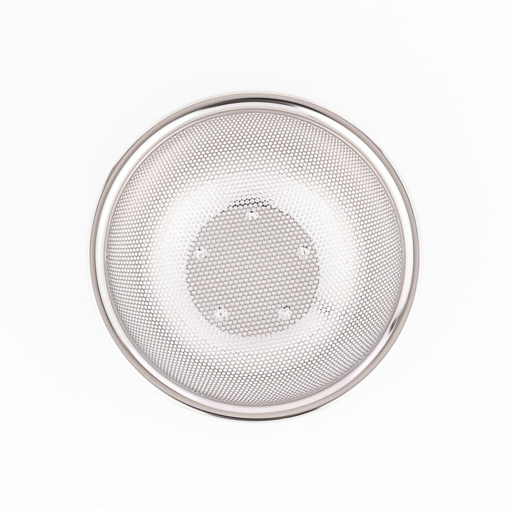 Fine mesh stainless steel strainer bowl with wide rim and curved shape, ideal for washing grains, fruits, or vegetables with ease.