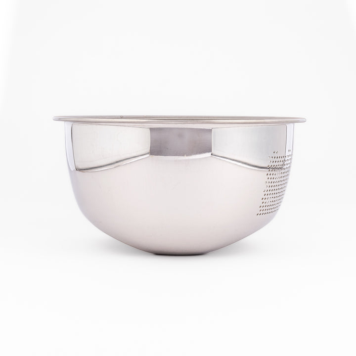 Stainless steel rice washing bowl viewed from above, featuring dual drainage sections—perforated and slotted—for quick, efficient rinsing.