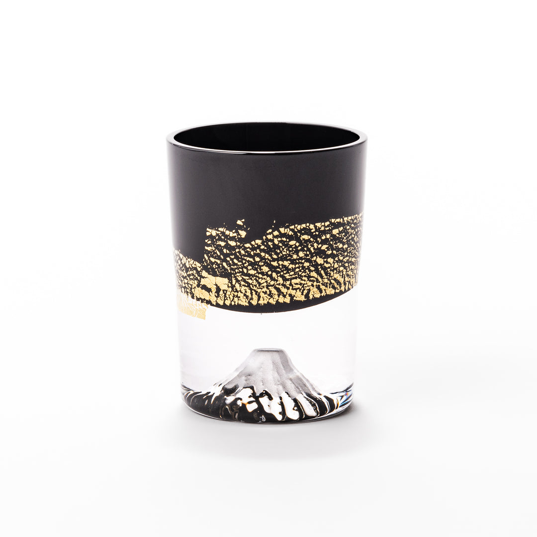 Black and clear sake glass with striking gold-leaf landscape and a Mount Fuji sculpture at the base, offering a bold take on Japanese elegance.