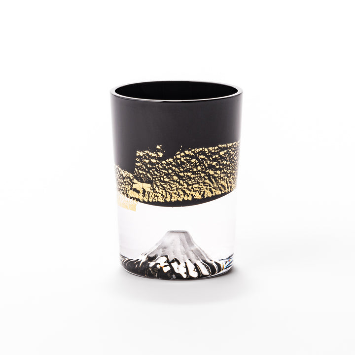 Black and clear sake glass with striking gold-leaf landscape and a Mount Fuji sculpture at the base, offering a bold take on Japanese elegance.