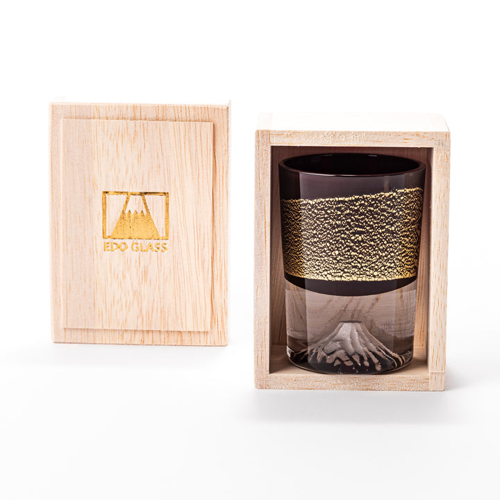 Deep red sake glass adorned with rich gold-leaf mountain scenery and a sculpted Mount Fuji at the base, offering a refined Japanese aesthetic.