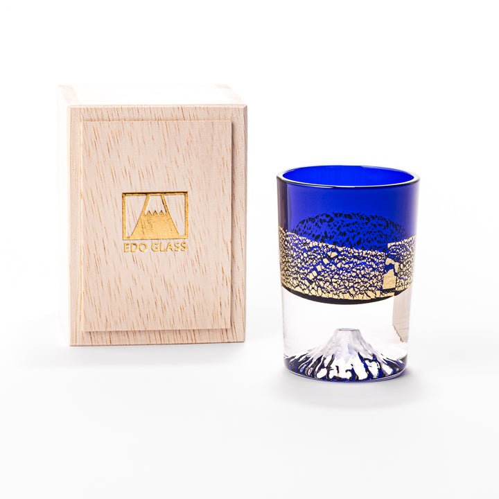 Deep blue sake glass with gold-leaf landscape design and detailed Mount Fuji motif sculpted inside the base, blending tradition and artistry.