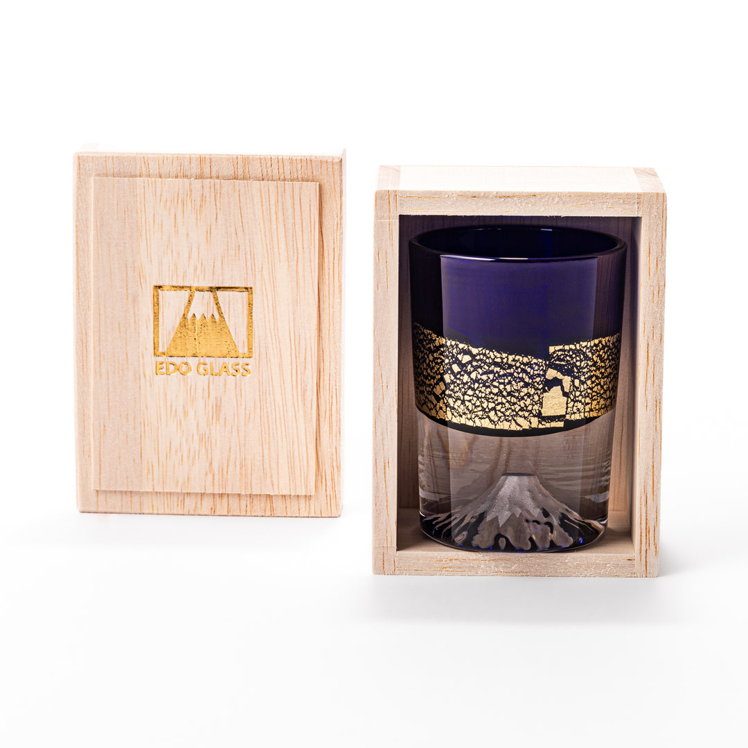 Deep blue sake glass with gold-leaf landscape design and detailed Mount Fuji motif sculpted inside the base, blending tradition and artistry.