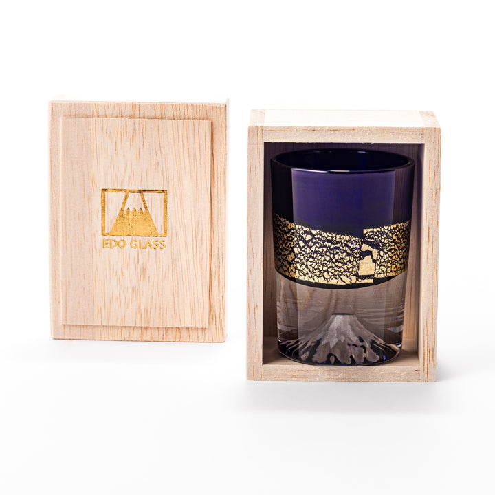 Deep blue sake glass with gold-leaf landscape design and detailed Mount Fuji motif sculpted inside the base, blending tradition and artistry.