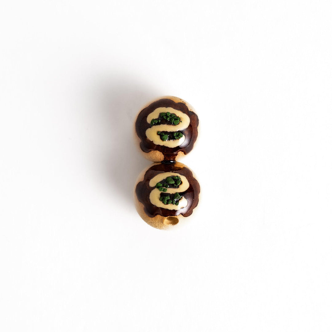 Adorable chopstick rest shaped like takoyaki, the popular Japanese snack, adding a playful touch to your table setting.